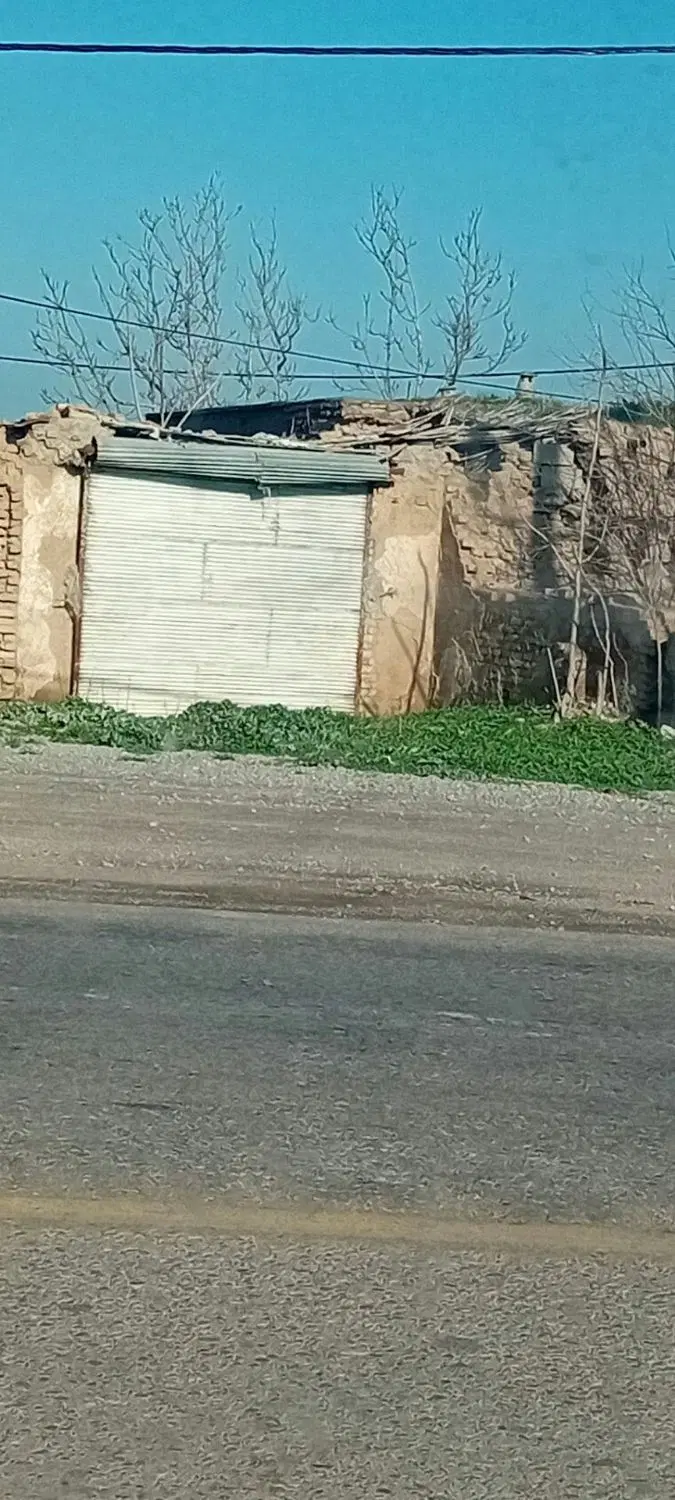 زمین و یک باب مغازه کنار جاده گنبد کلاله