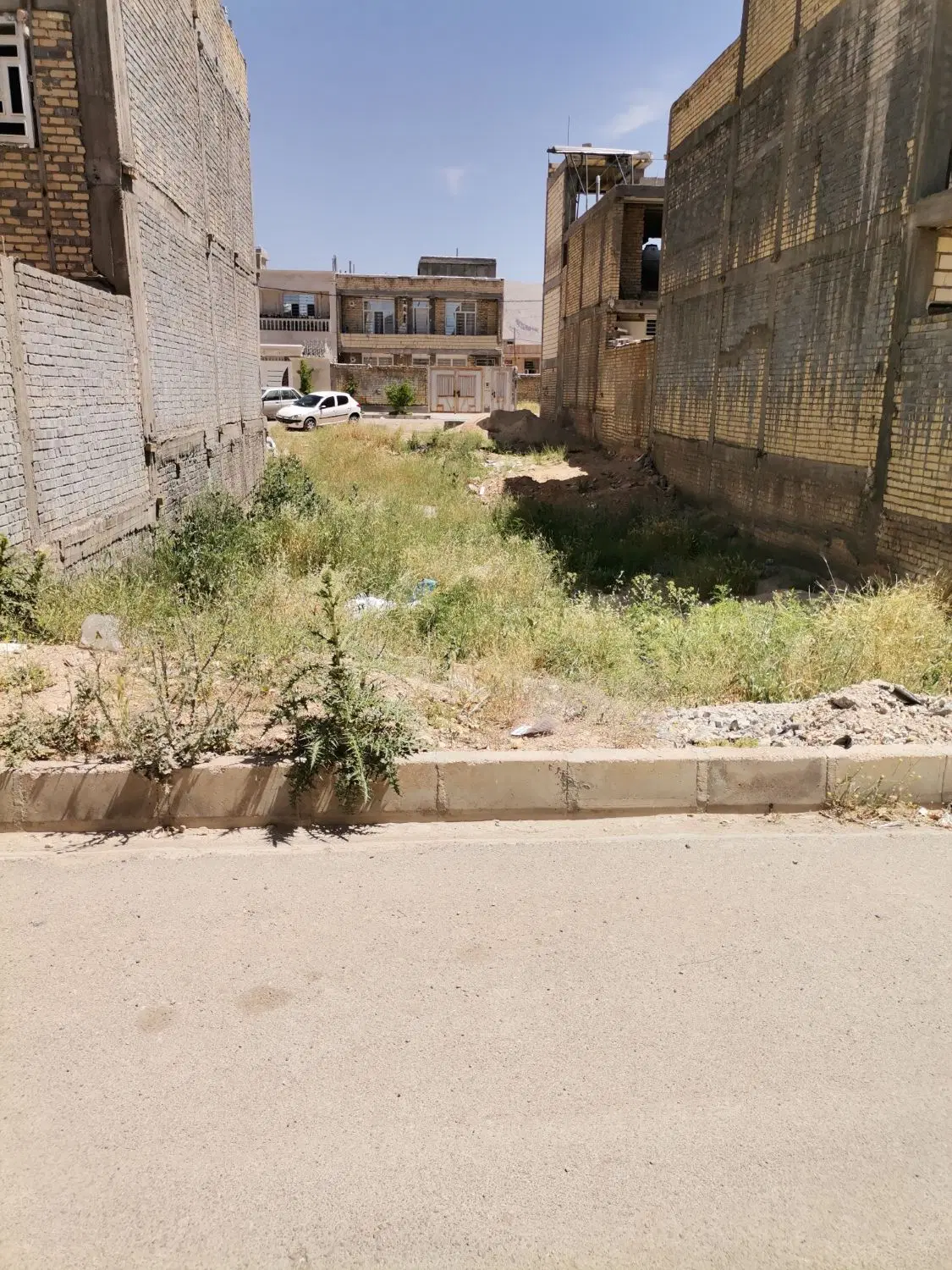 زمین شهرک صادقیه درب حیاط