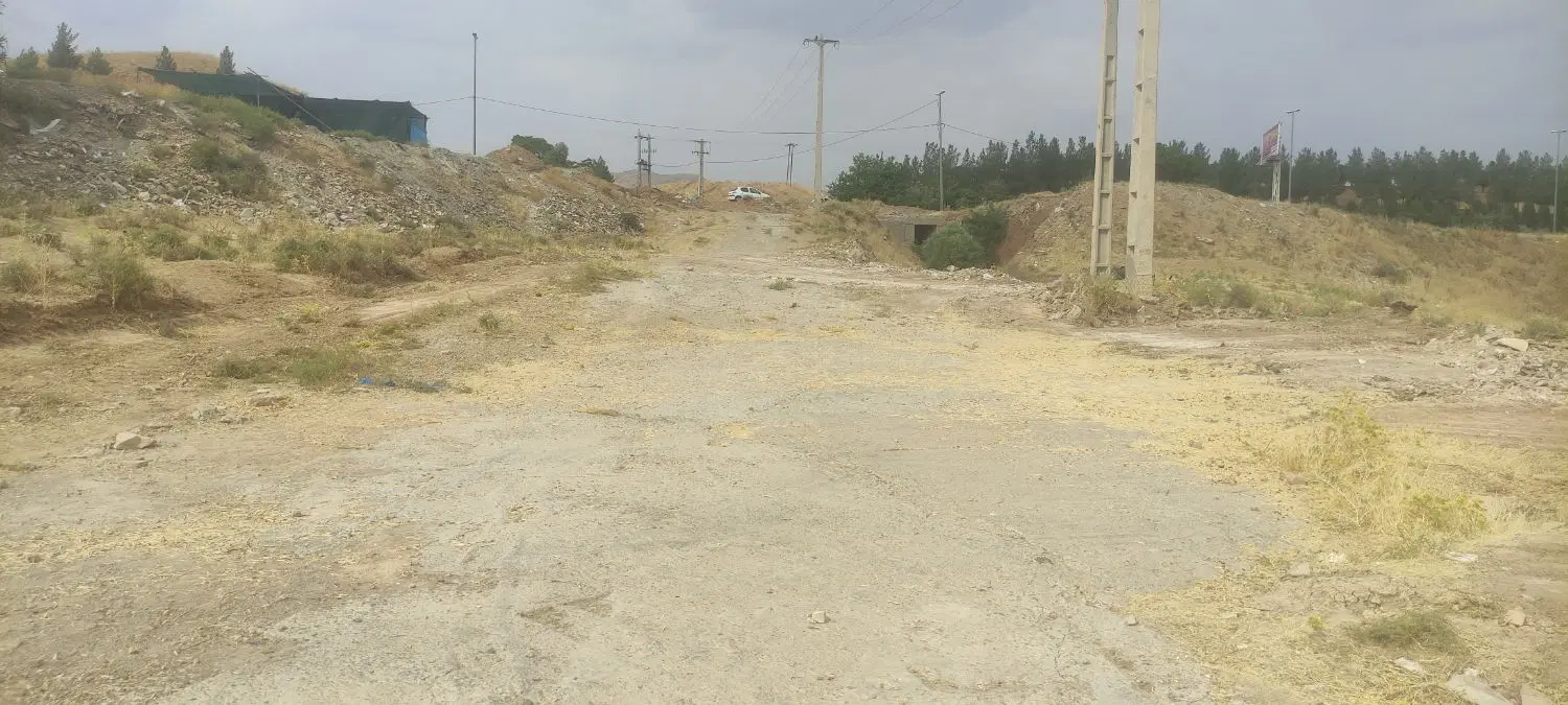 زمین جلو خیابون اصلی در کمالوند بالاتر از کهریز