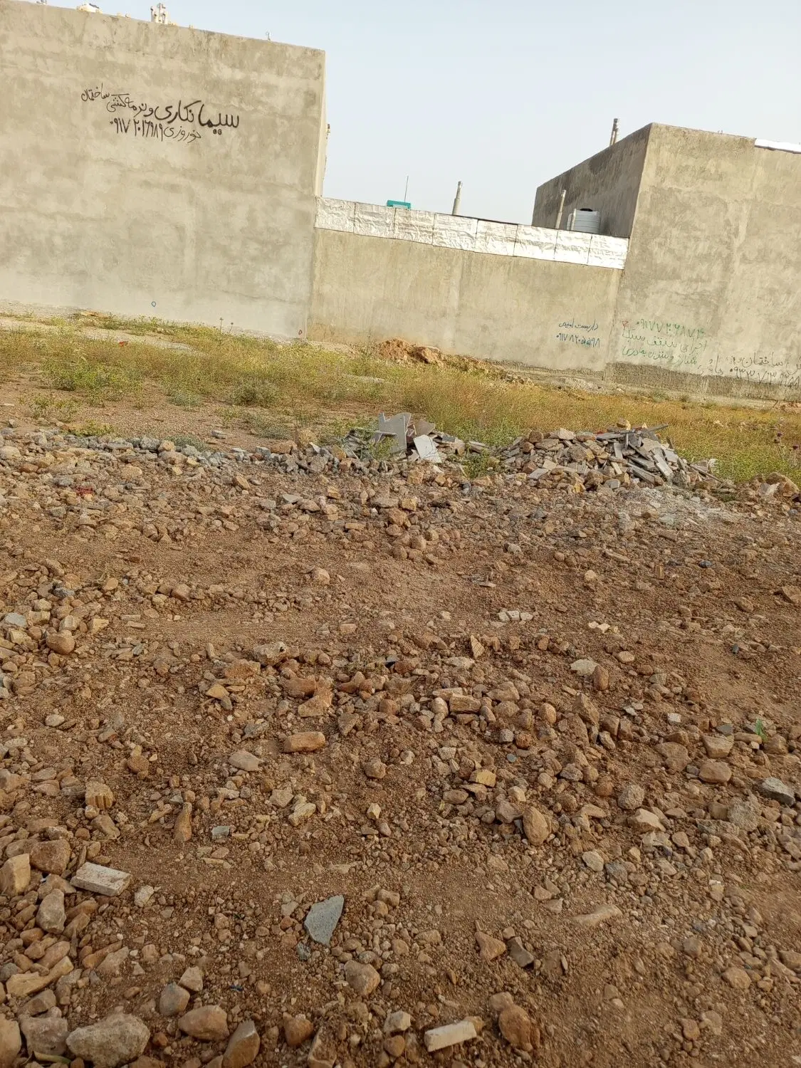 زمین درب ساختمان روبروی مجتمع گلها